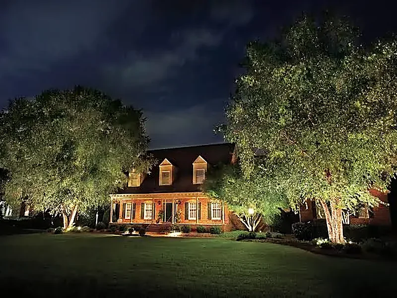 Colonial home with facade lighting in the Franklin, TN area at dusk